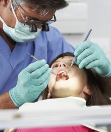 Girl Having Check Up With Dentist